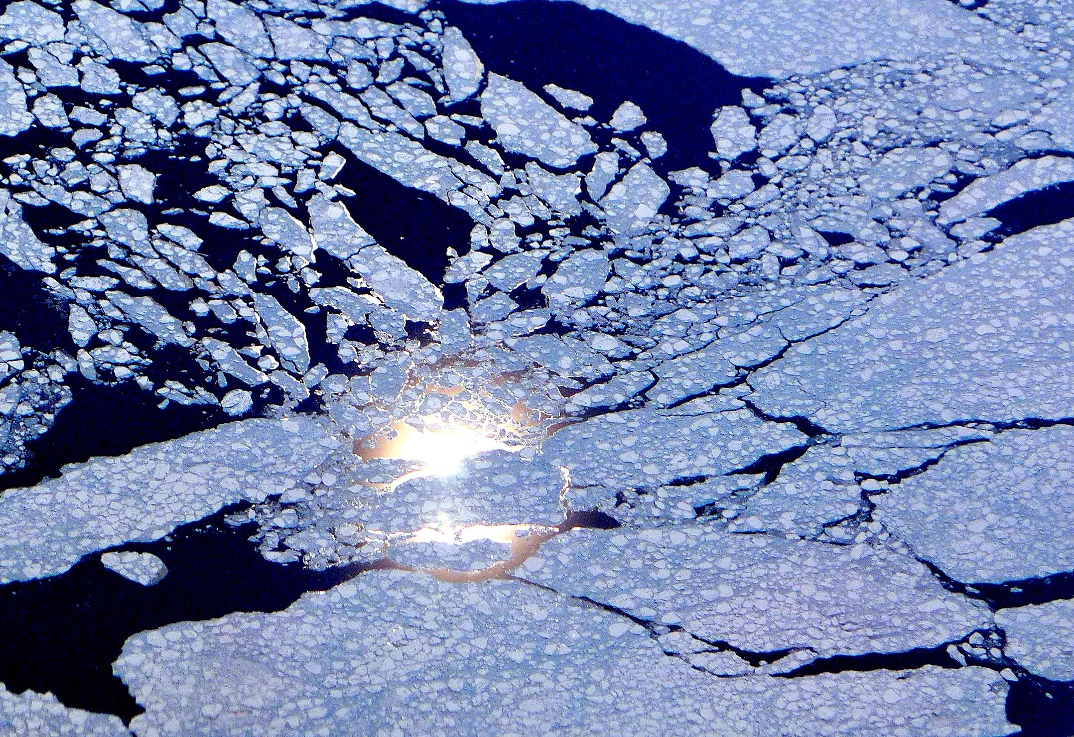 Sun reflection behind sea ice