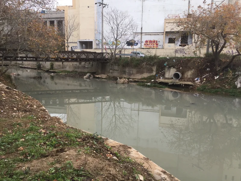 Kifisos river near houses at Athens, Greece