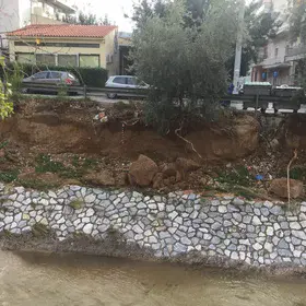 Kifisos River near houses at Athens, Greece