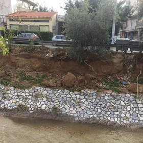 Kifisos River near houses at Athens, Greece
