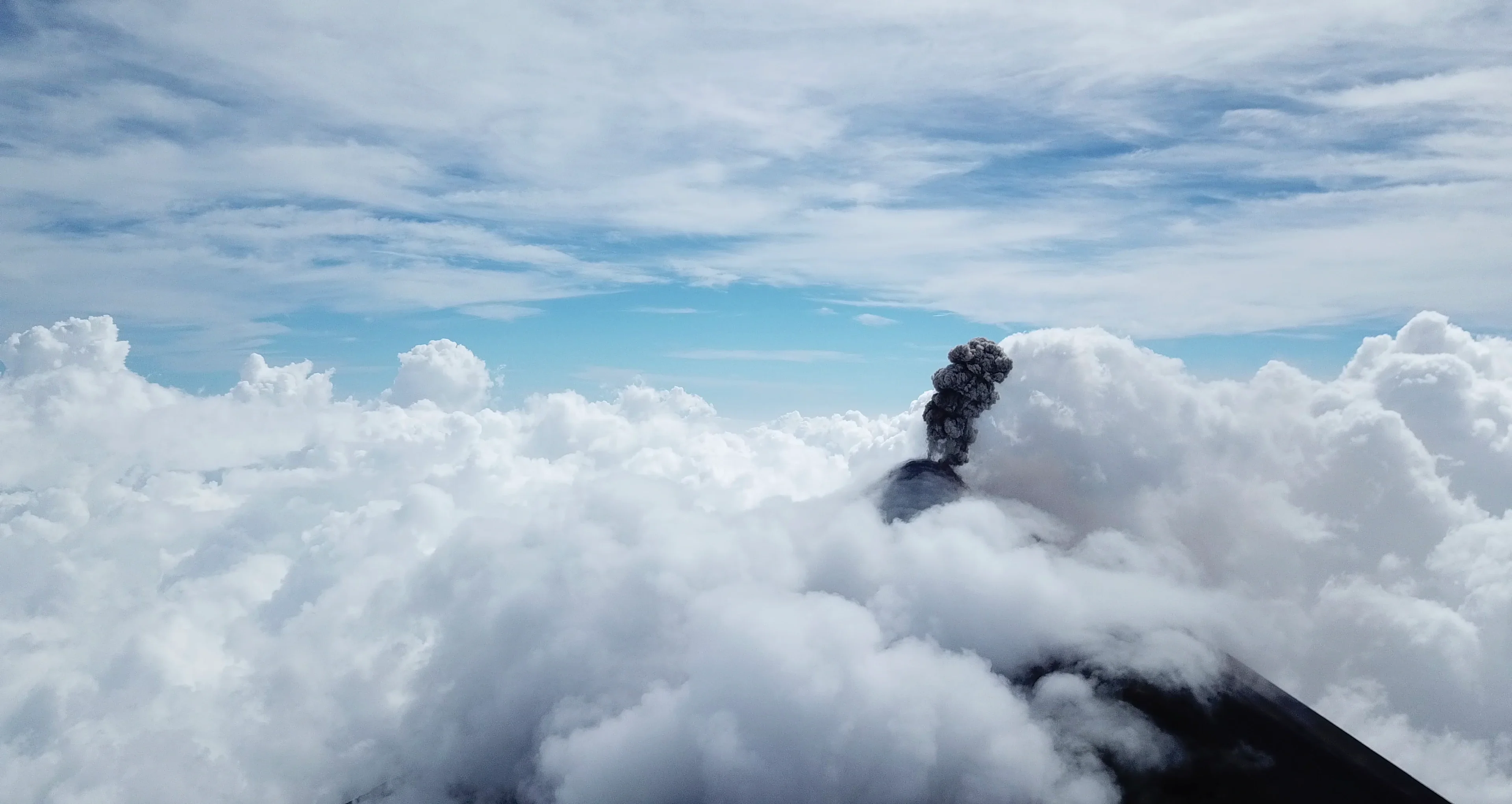 Fuego Eruption Plume Meets Cloud Bed