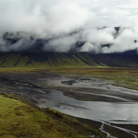 Lake near the mountain in the clouds