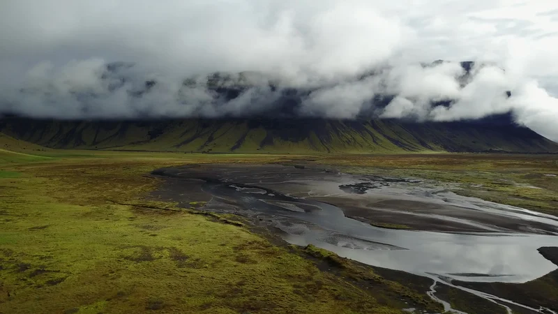 Lake near the mountain in the clouds
