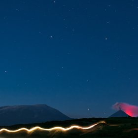 Eruption of the Kluchevskaya Sopka glowing in the night.
