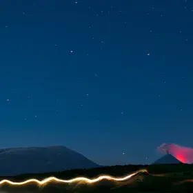 Eruption of the Kluchevskaya Sopka glowing in the night.