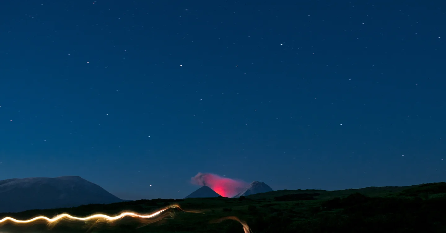 Eruption of the Kluchevskaya Sopka glowing in the night.