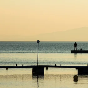 Man and sea, sunset on island of Rab
