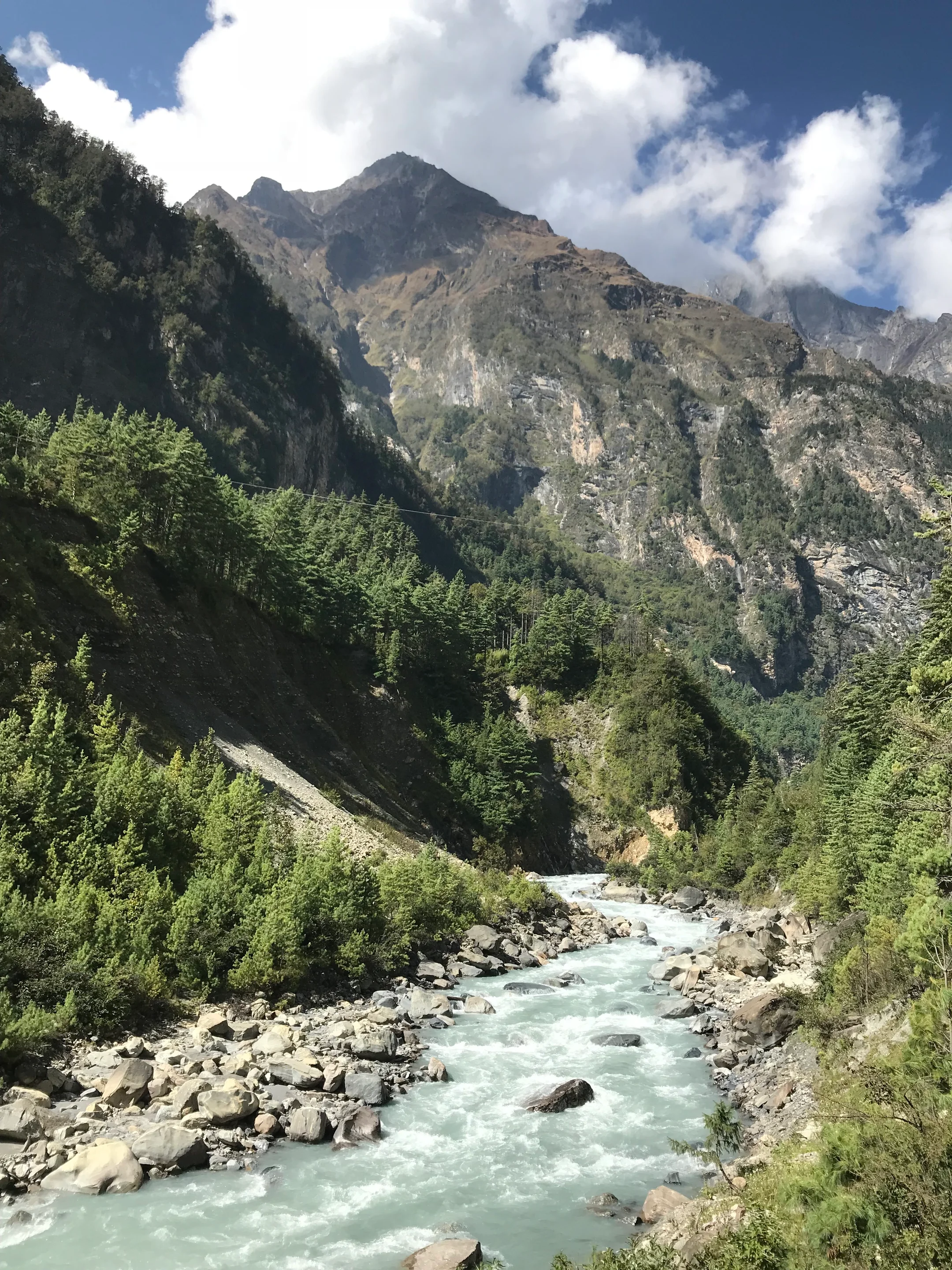 Glowing river flow on rocky streambed