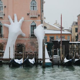 Giant Hands, called Support, in a rare snowy event in a floating city of Venice