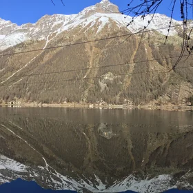 Lake mirroring effect at Ceresole Reale, in Gran Paradiso Park.