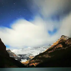 Night sky over the emerald glacier Lake