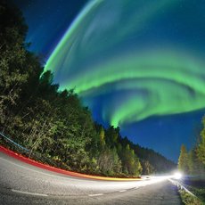 Aurora show on the road by Junbin Zhao