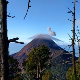 Lenticular clouds over Volcán de Fuego in eruption
