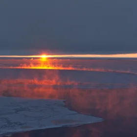 Sunset sea smoke, Antarctica