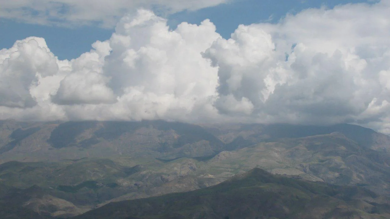 The combination of mountain and cloud in Shah Alborz Mountain Range - Alborz Mountains - Qazvin - Iran