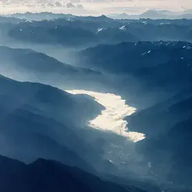 "River" of clouds in an Alpine valley