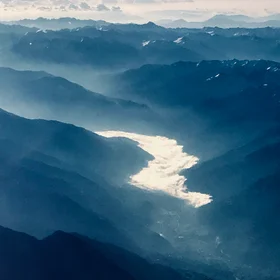 "River" of clouds in an Alpine valley