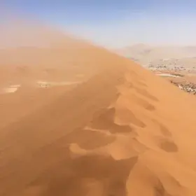 Flying sand in Namib Desert