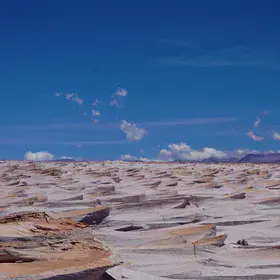 A volcanic change of matter: ashes to waves