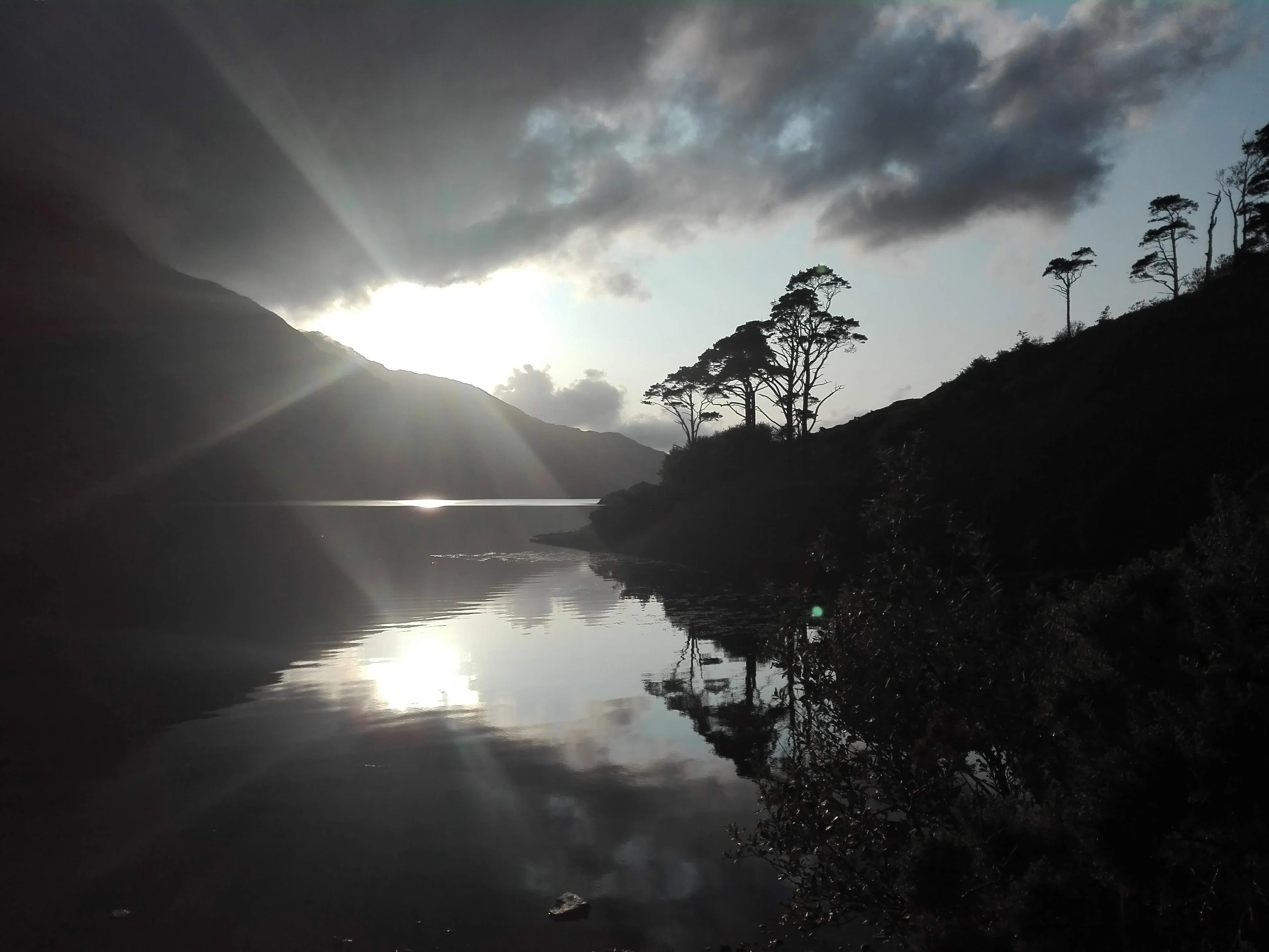 Sun peaking through the clouds at the Killary Fjord