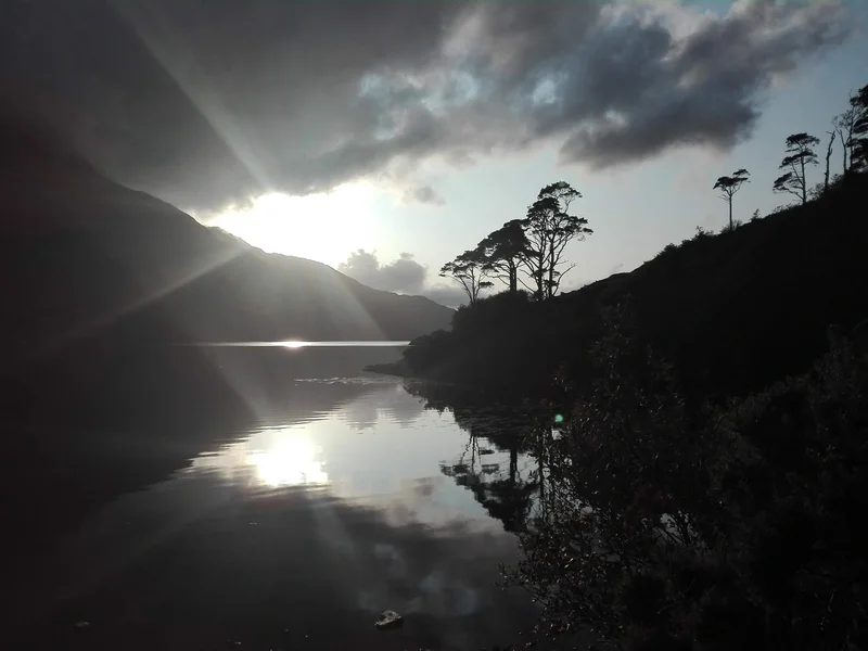 Sun peaking through the clouds at the Killary Fjord