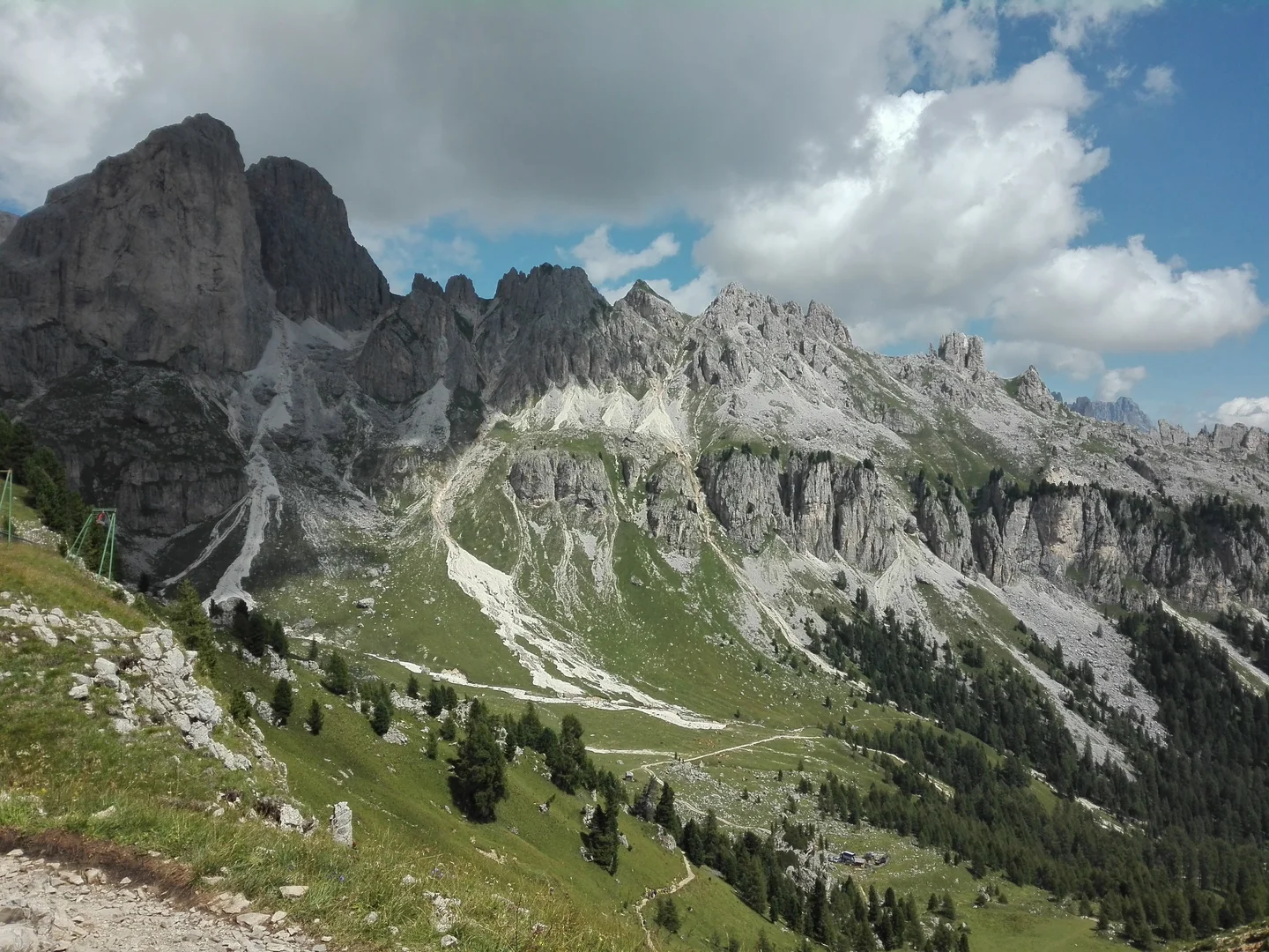 Ragged peaks and green valleys in a scarred landscape
