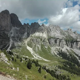 Ragged peaks and green valleys in a scarred landscape