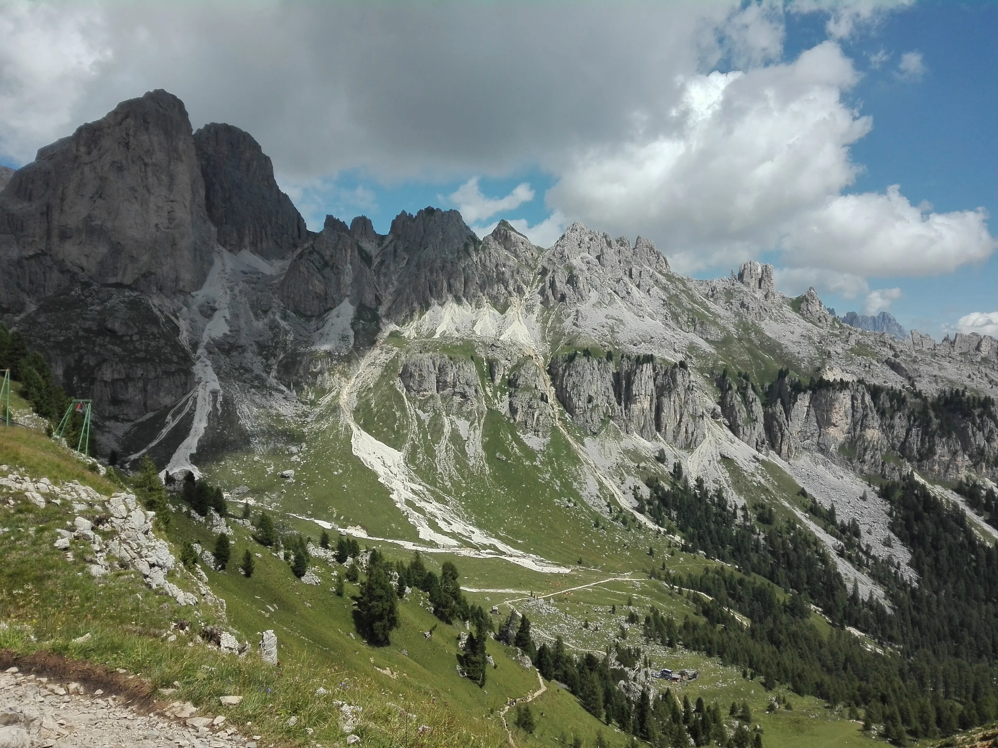 Ragged peaks and green valleys in a scarred landscape