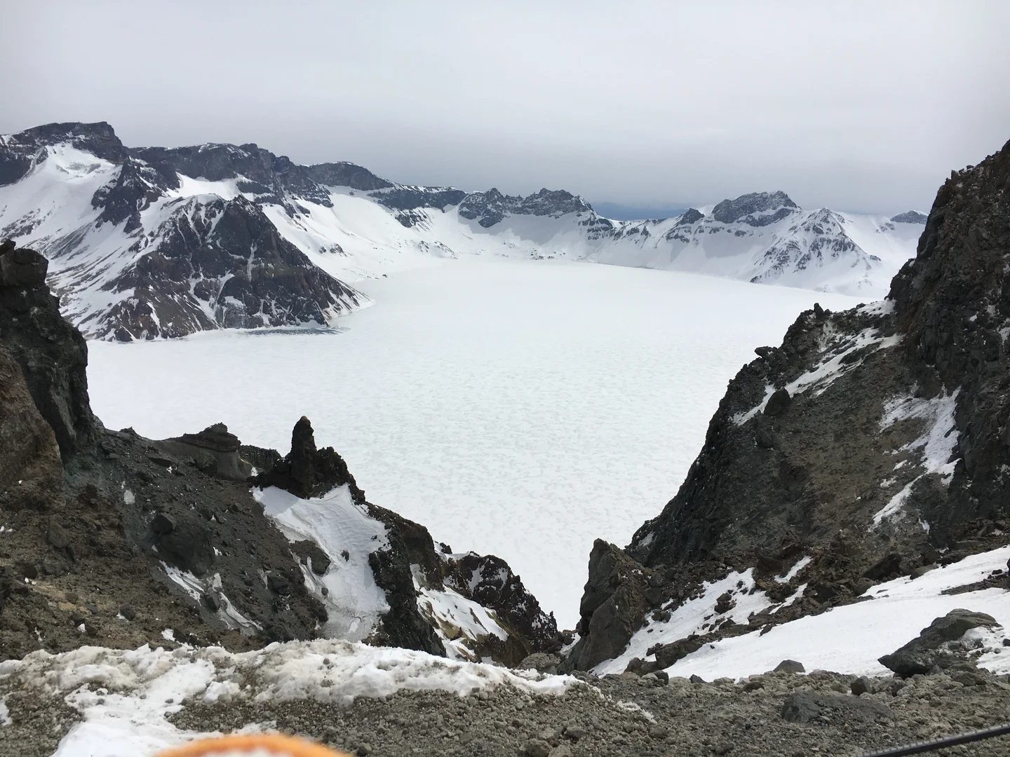 Tianchi covered by snow, from the northern slope of Changbai Mountain, China