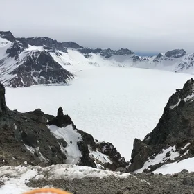 Tianchi covered by snow, from the northern slope of Changbai Mountain, China