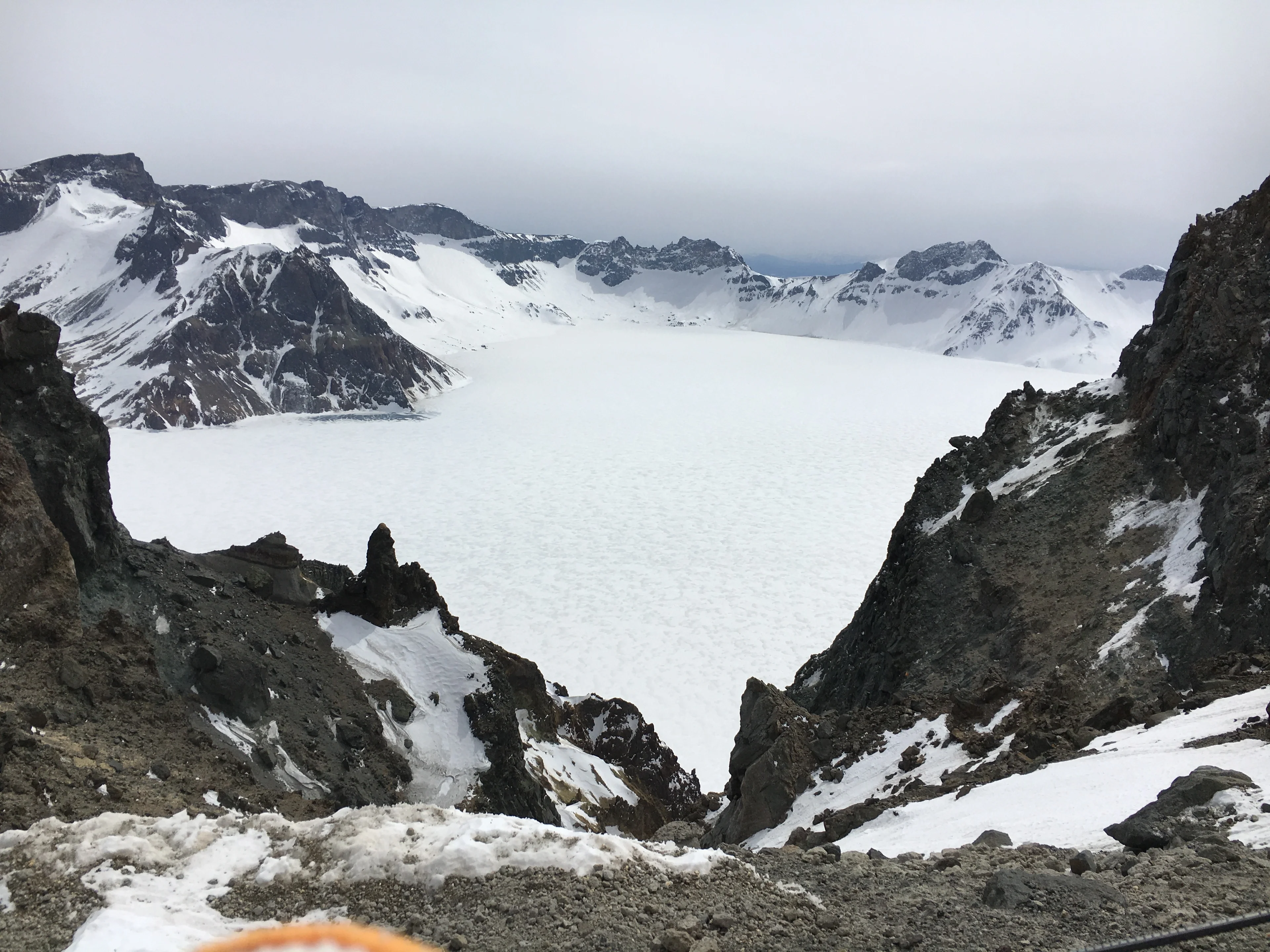Tianchi covered by snow, from the northern slope of Changbai Mountain, China