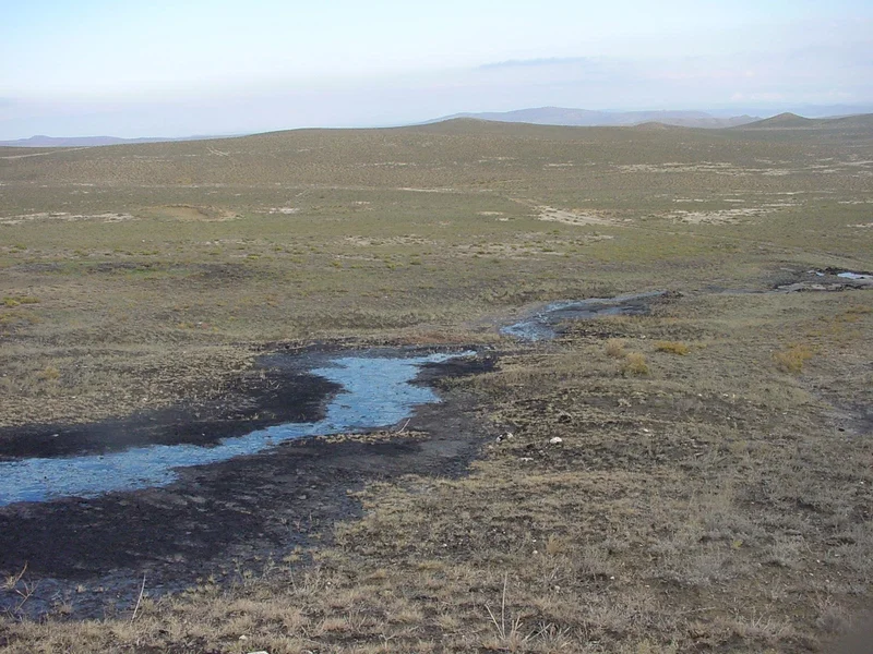 Azerbaijan, Kobustan area, oil river from active mud volcano