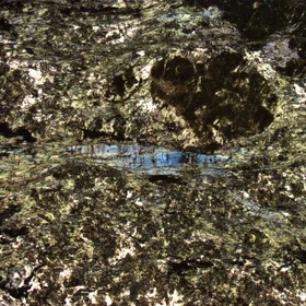 Glaucophane grains in retrogressed metabasalt