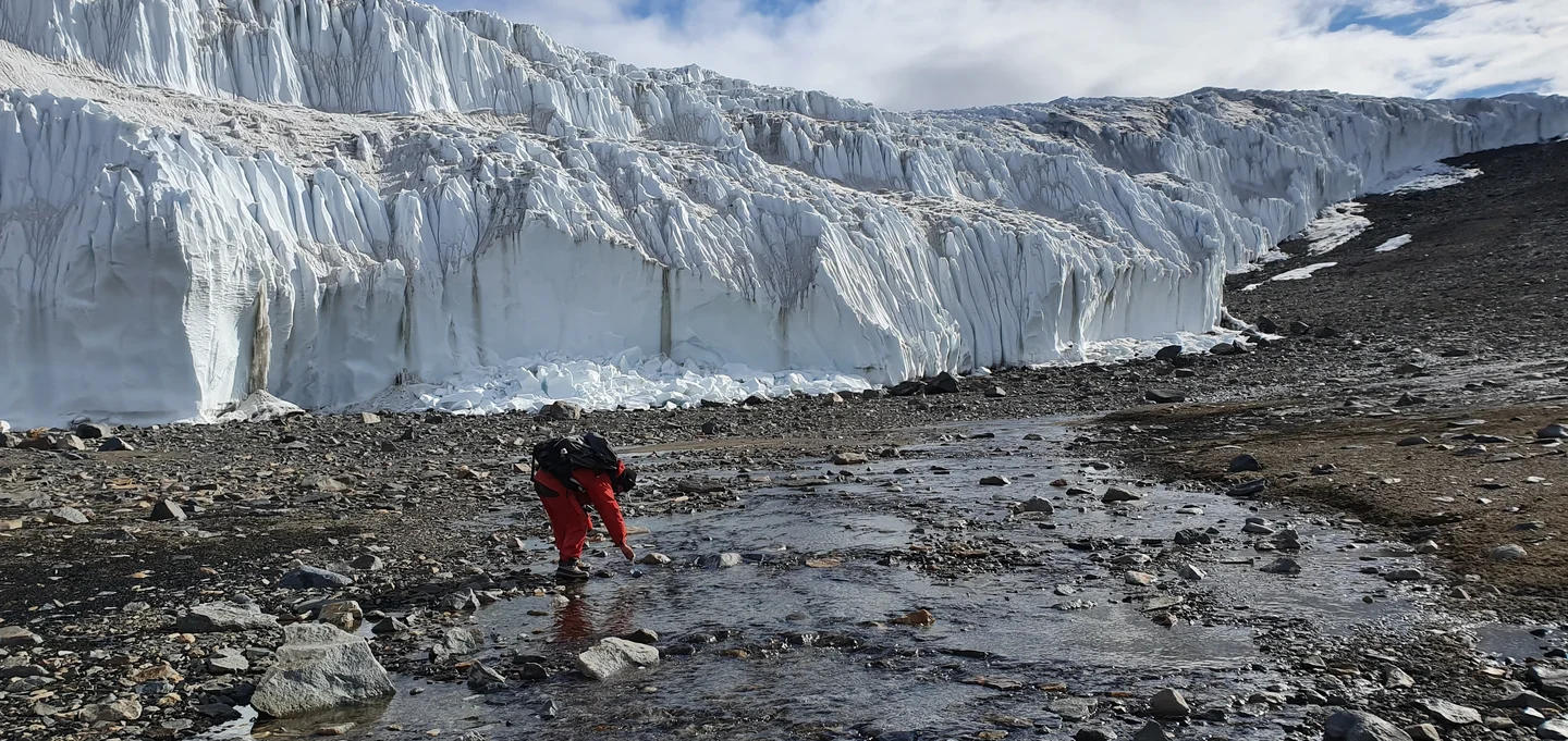 Sampling meltwater of Canada Glacier