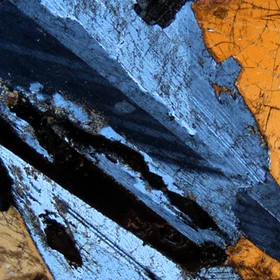 A thin section shows a coarse plagioclase mineral grain