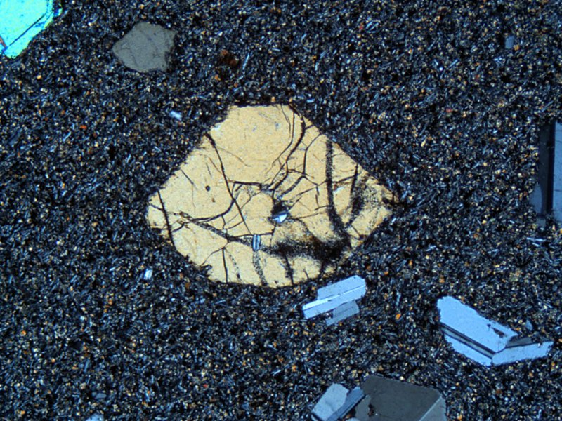An euhedral crystal (the biggest one in the photo) in groundmass matter