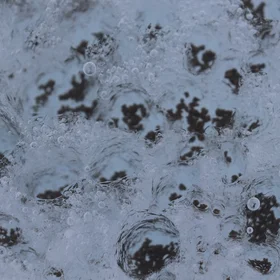 Icy melt channels by black gravel