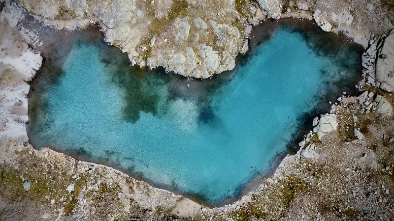 An azure heart over Italian Alps