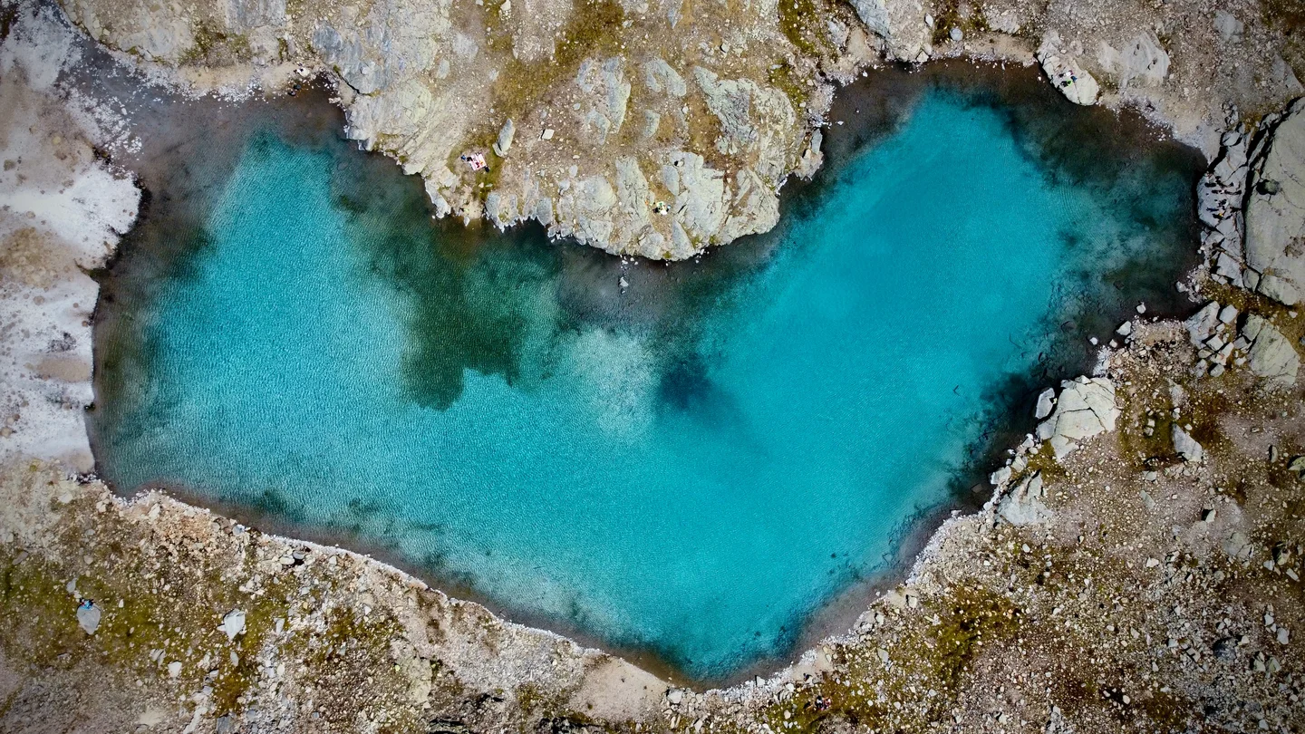 An azure heart over Italian Alps