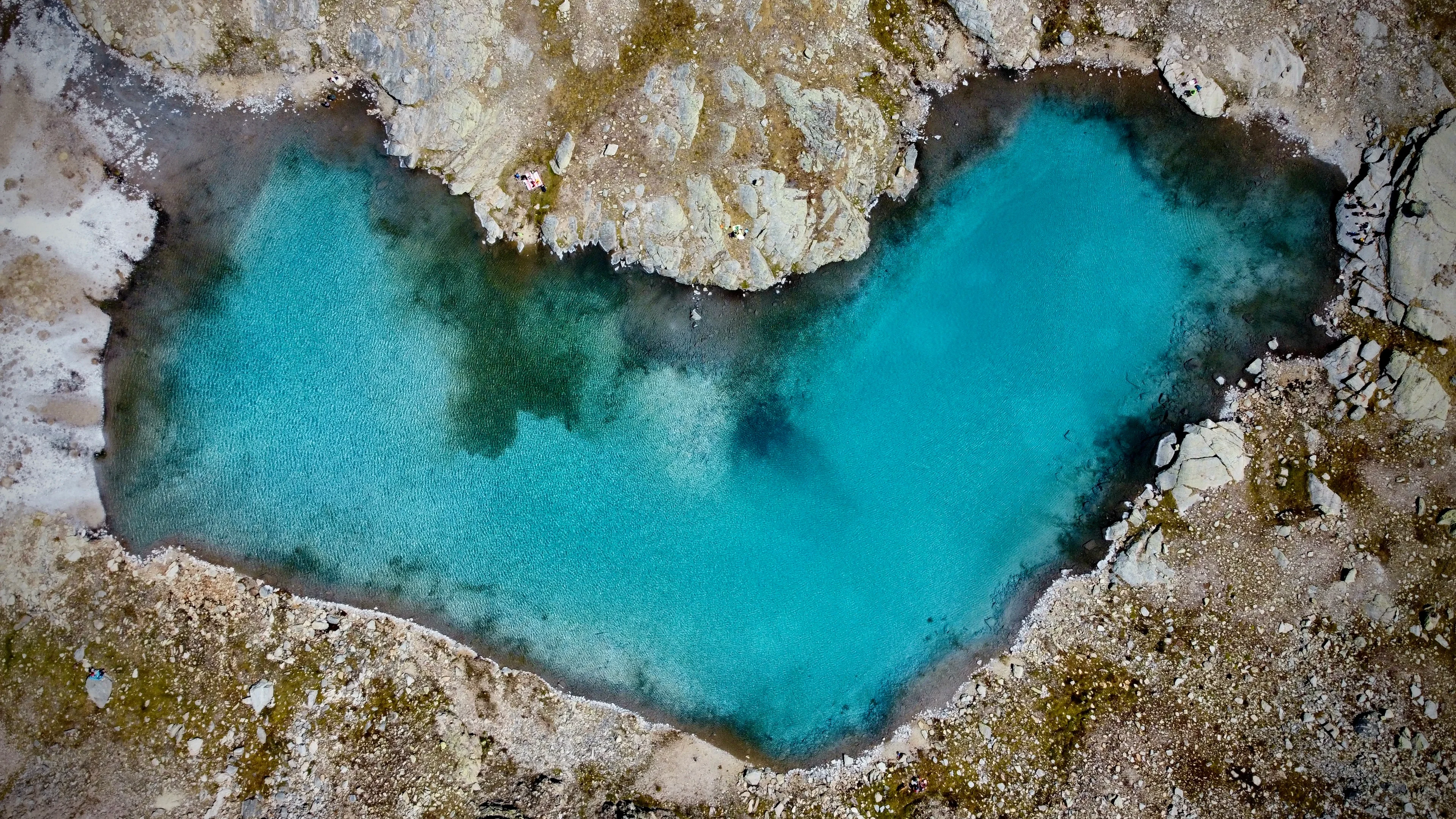 An azure heart over Italian Alps