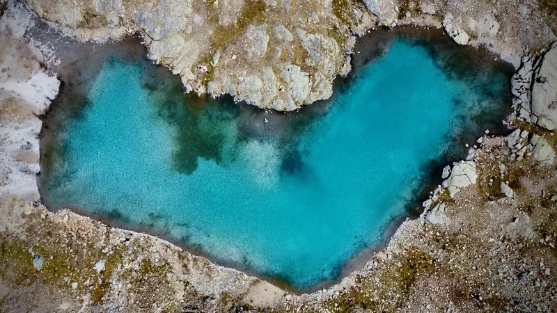 An azure heart over Italian Alps