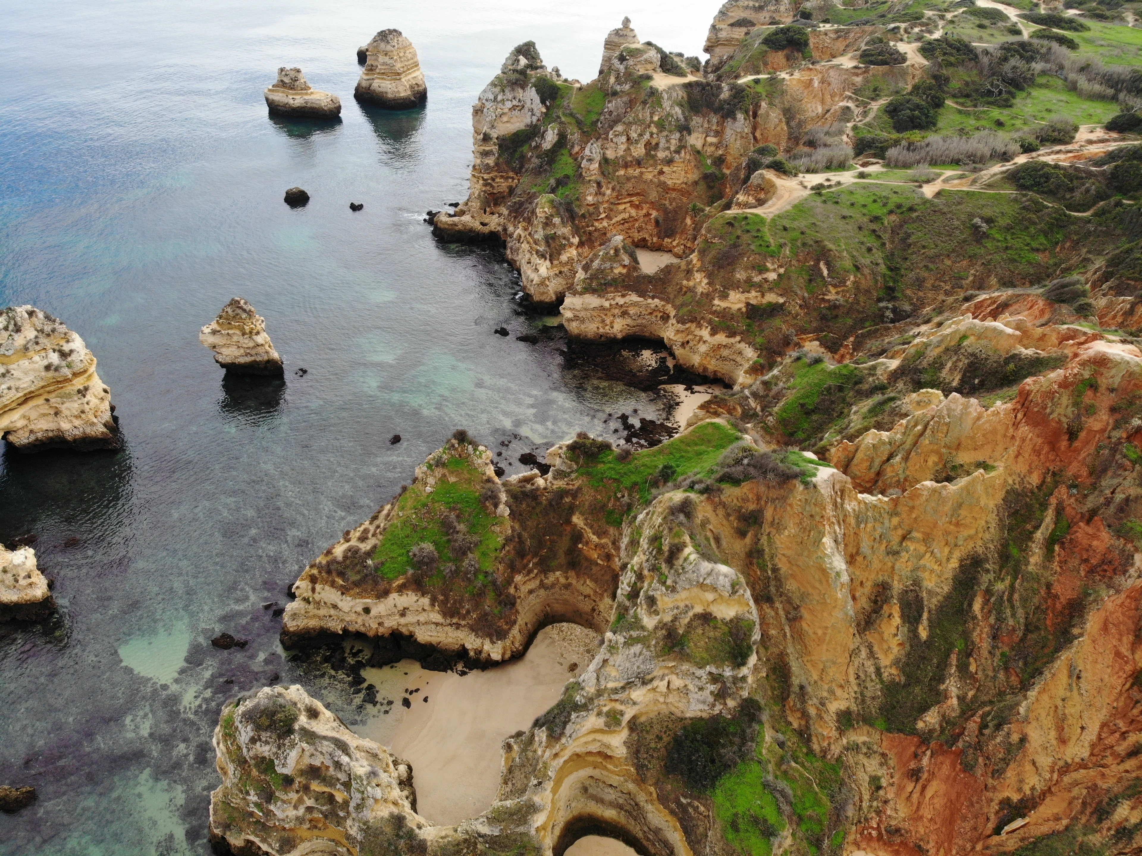 Rugged golden cliffs staring at a calmed ocean