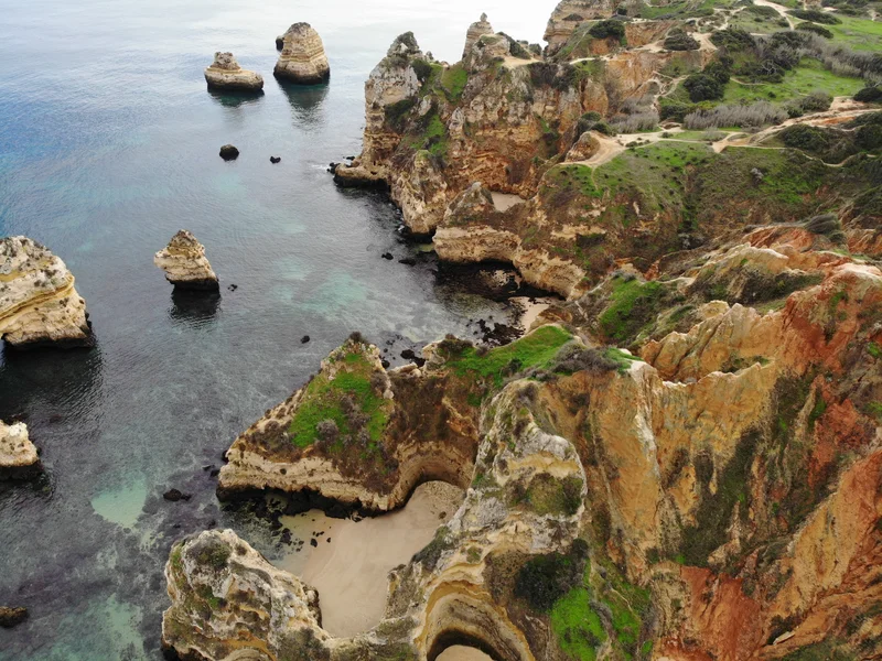 Rugged golden cliffs staring at a calmed ocean