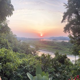 Sunset over the Tena river from the Amazon Jungle