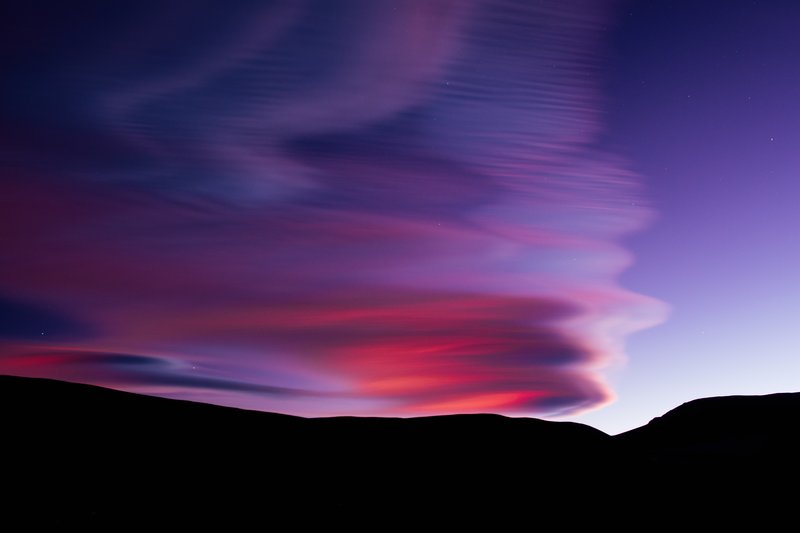 Stacked Lenticular Clouds at Twilight