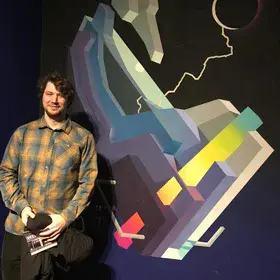 Happy scientist with artwork