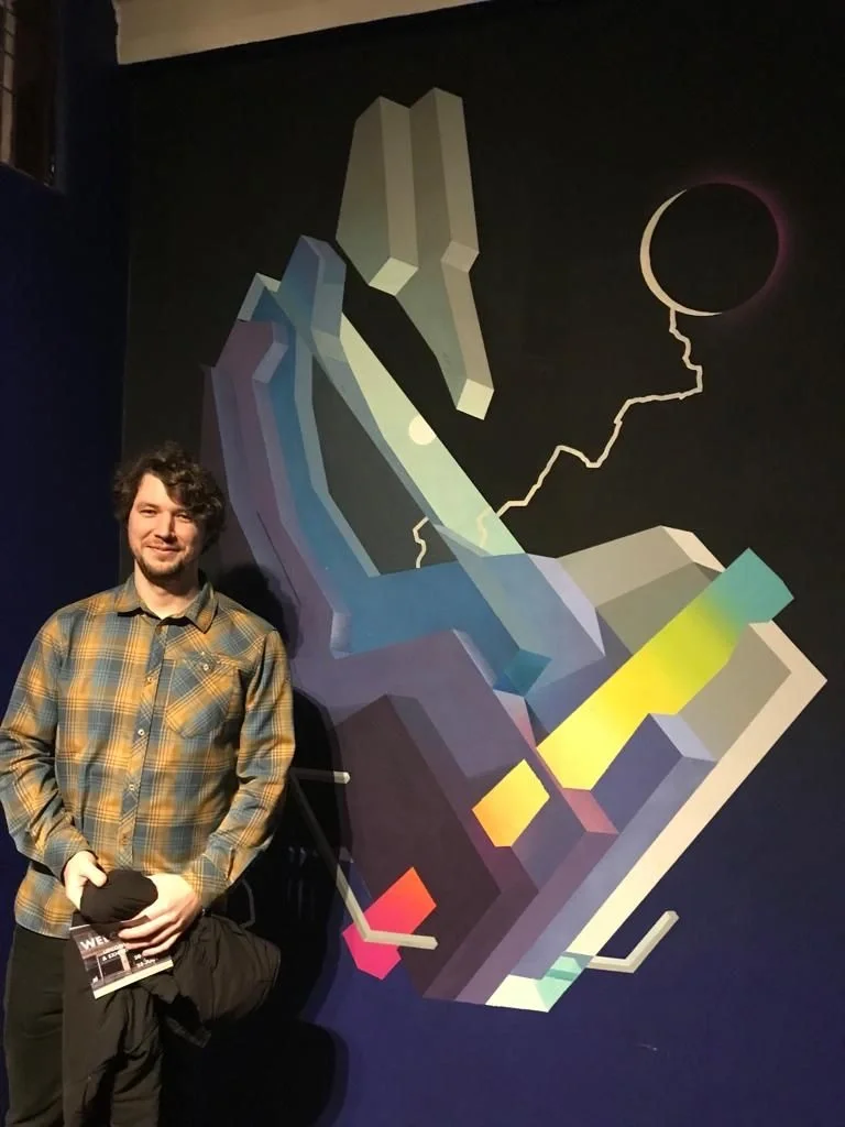 Happy scientist with artwork