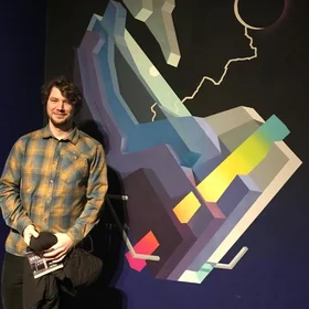 Happy scientist with artwork