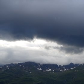 Dark clouds forming over Piz Champatsch in the Lower Engadin, Switzerland