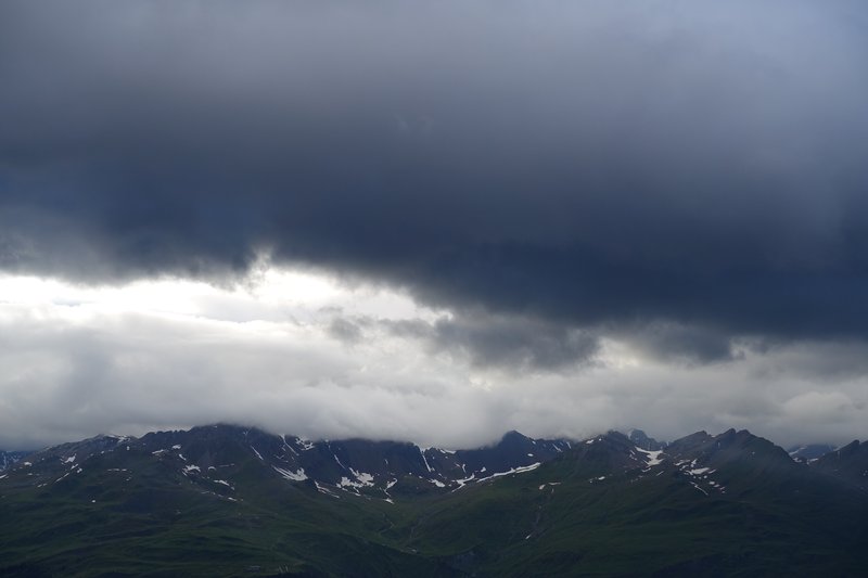 Dark clouds forming over Piz Champatsch in the Lower Engadin, Switzerland